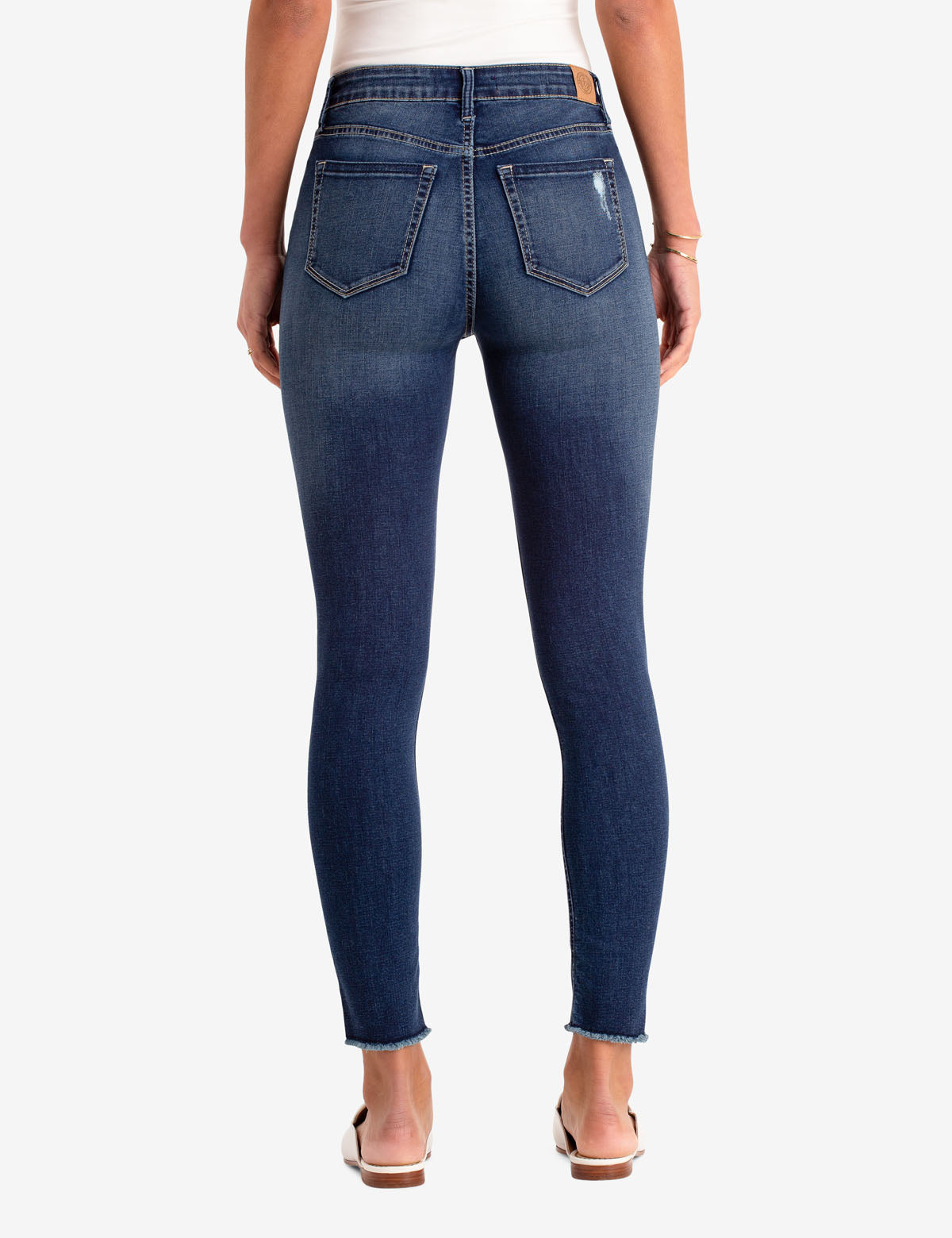 REPREVE® High Rise Destructed Jegging - Eco-Friendly Stretch Jeans