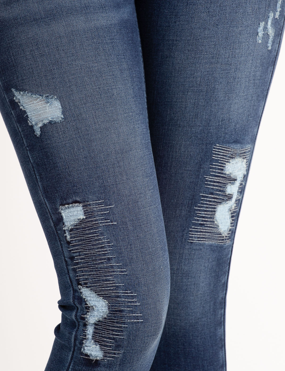 REPREVE® High Rise Destructed Jegging - Eco-Friendly Stretch Jeans